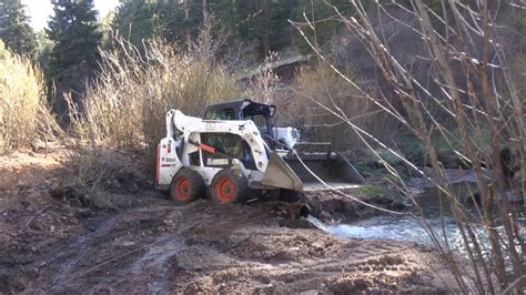 bobcat skid steer stuck in mud|skid steer stuck in the mud.